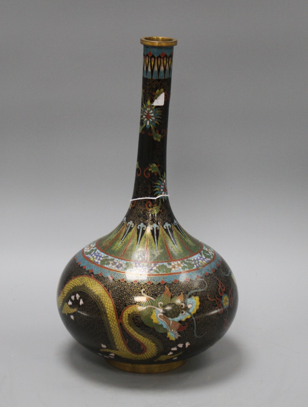 An early 20th century Chinese cloisonne vase, decorated with dragons on a black ground, height 38cm